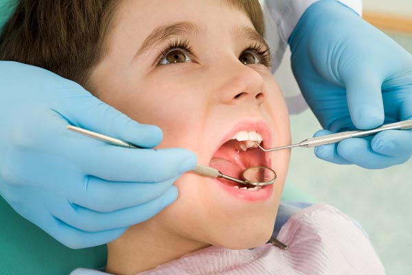 Image of a child getting a dental exam