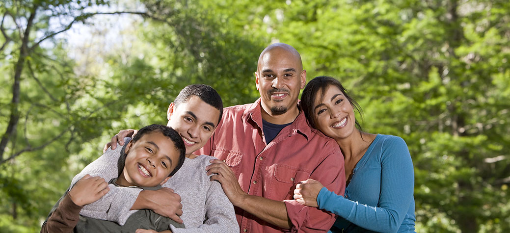 Portrait of Hispanic Family with Excellent Dental Care